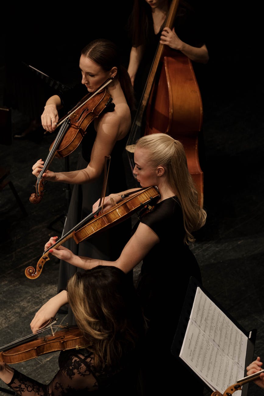 women playing violin in sn orchestra